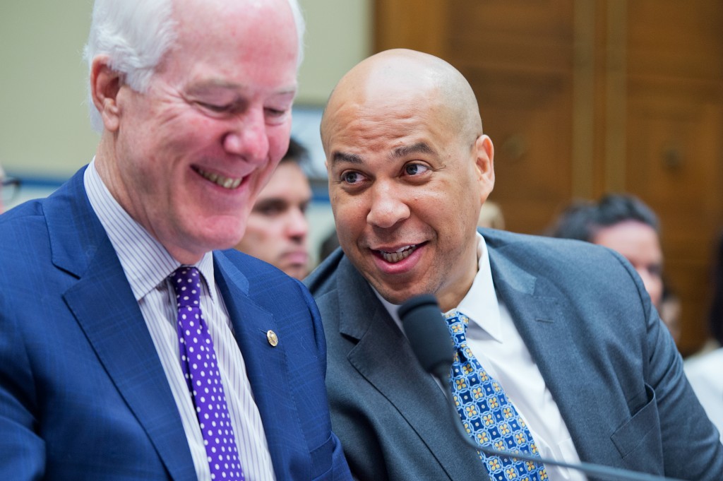 Senator Johnson Cornyn, R-Texas, left, talks with Sen. Cory Booker, D-N.J., during a House Oversight and Government Reform Committee hearing on criminal justice reform, July 14, 2015. (Photo: Tom Williams/CQ Roll Call/Newscom)