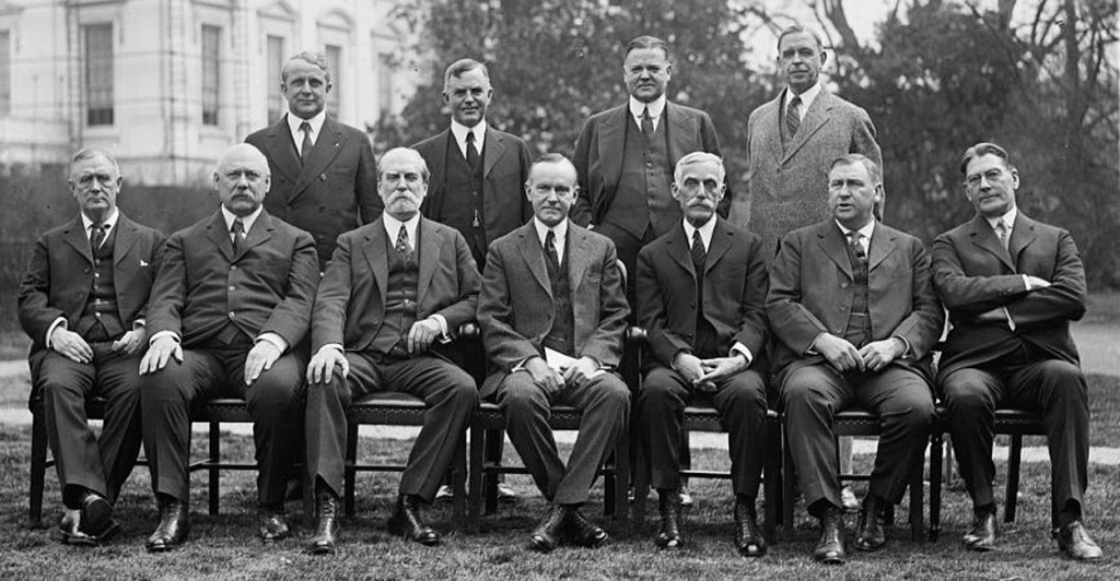 President Calvin Coolidge's cabinet in 1924, outside the White House. Front row, left to right: Harry Stewart New, John W. Weeks, Charles Evans Hughes, Coolidge, Andrew Mellon, Harlan F. Stone, Curtis D. Wilbur. Back row, left to right, James J. Davis, Henry C. Wallace, Herbert Hoover, Hubert Work. (Photo: Library of Congress)