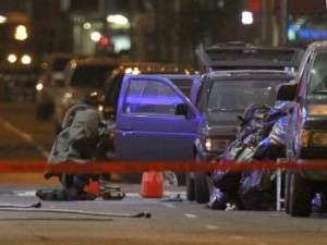 A NYPD officer in an bomb suit examines a Nissan Pathfinder sport utility vehicle parked in New York's Times Square May 1, 2010. An  failed car bomb that was smoking and emitted a "flash" in a sport utility vehicle sparked an evacuation of New York's Times Square was found to be linked to Islamic Terrorism.