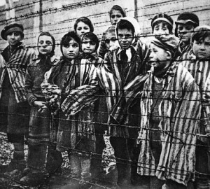 Children behind a barbed wire fence at the Nazi concentration camp at Auschwitz in Southern Poland.   (Getty Images)