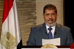 Morsi speaks during his first televised address to the nation