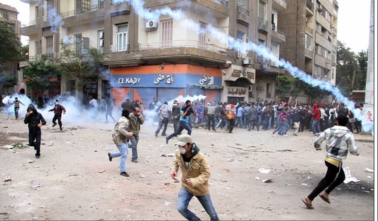 Egyptians Running From Gas Canisters