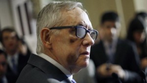 Reid wears therapeutic glasses during a news conference after the weekly Senate Democratic policy luncheon at the U.S. Capitol in Washington